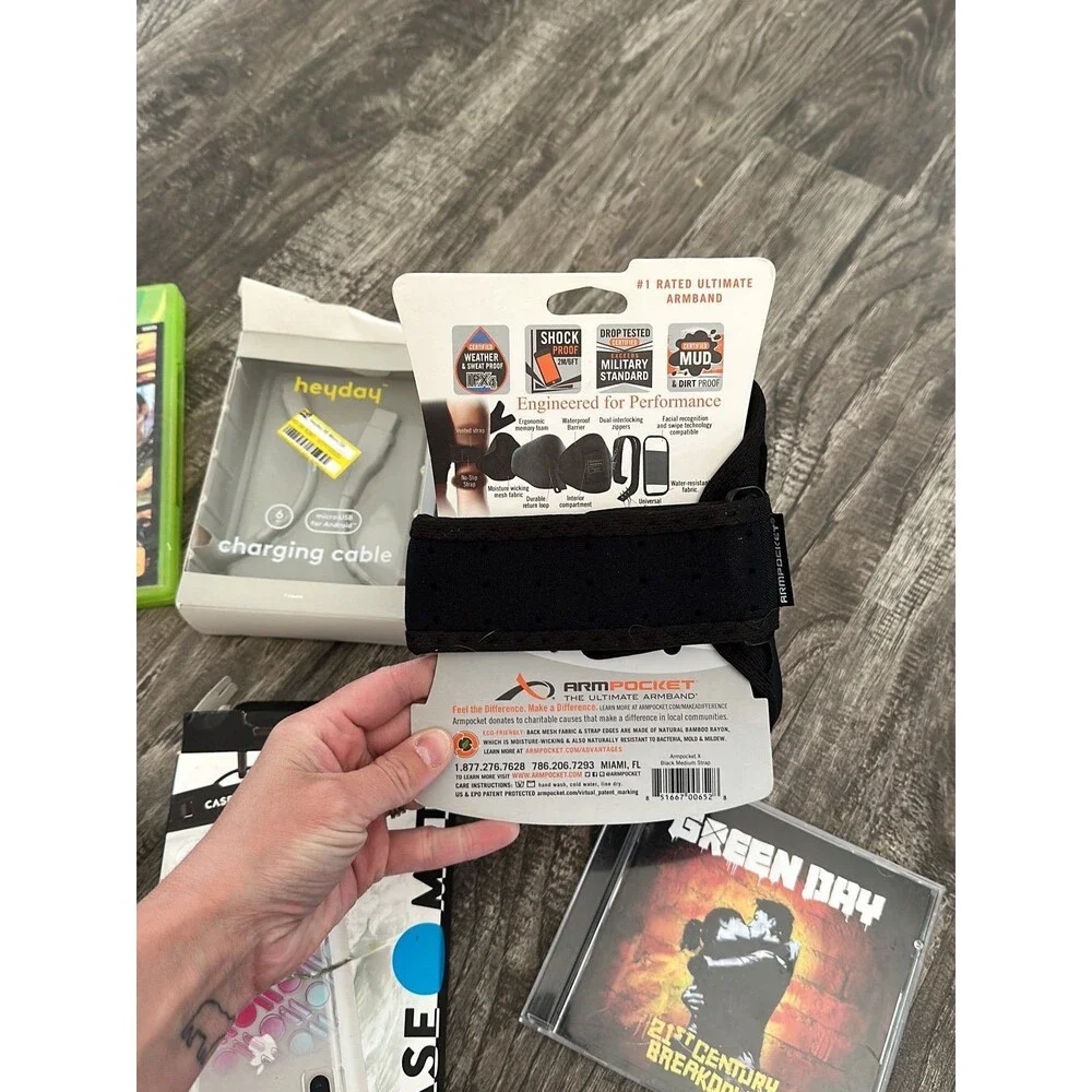 Lot of cellphone accessories, Xbox games and CD